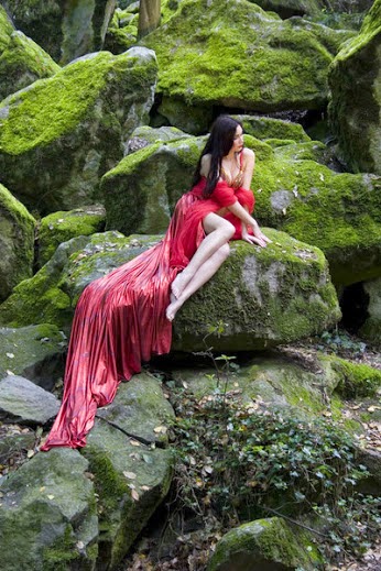 red lady on the rocks