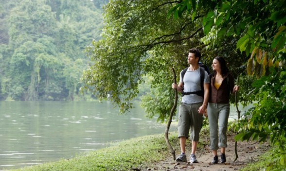 couple-walking-by-a-lake-in-the-forest-588x352