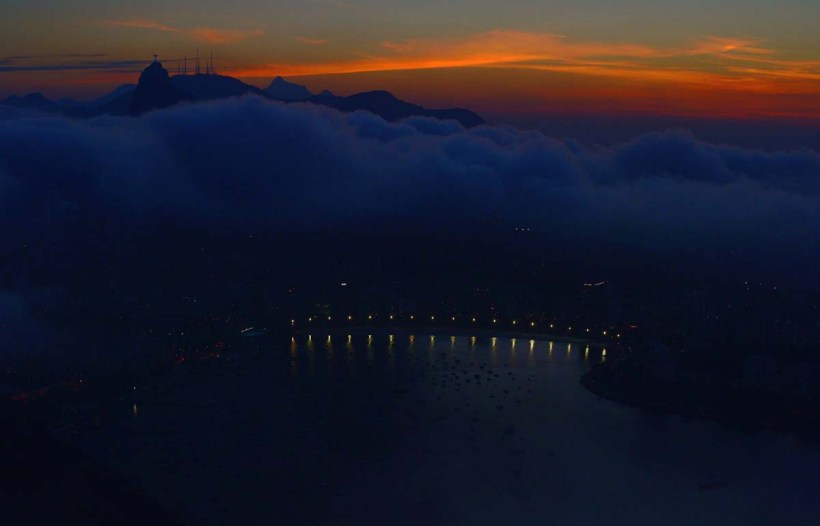 TOPSHOTS The Christ the Redemer statue is seen atop Corcovado Hill in Rio de Janeiro, Brazil on July 3, 2014. AFP PHOTO/Carl de SouzaCARL DE SOUZA/AFP/Getty Images ORG XMIT: