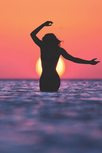 sunset_wading_woman