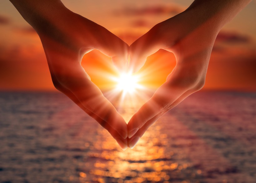 sunset in heart hands