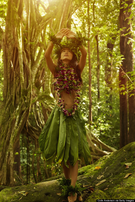 Asian woman performing traditional dance in jungle